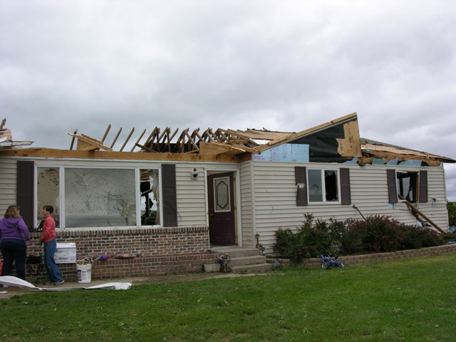 House damaged near Amherst. Photo by NWS staff.